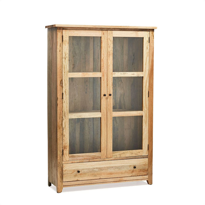 Mueble de madera con dos puertas de vidrio divididas en secciones rectangulares y un cajón en la parte inferior con tiradores redondos de metal negro. El diseño es rústico y exhibe vetas naturales de la madera.